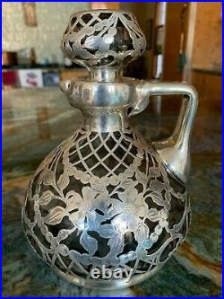Beautiful lidded antique/vintage glass decanter with heavy sterling onlay