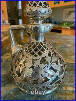 Beautiful lidded antique/vintage glass decanter with heavy sterling onlay