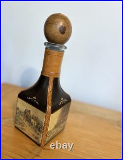 Fausto Conturi Vintage Italian leather-wrapped decanter with embossed scenes