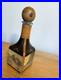 Fausto-Conturi-Vintage-Italian-leather-wrapped-decanter-with-embossed-scenes-01-xgjy