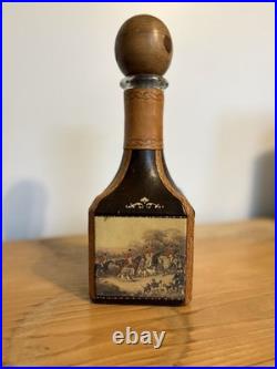 Fausto Conturi Vintage Italian leather-wrapped decanter with embossed scenes
