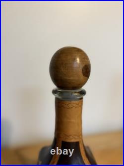 Fausto Conturi Vintage Italian leather-wrapped decanter with embossed scenes