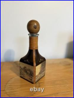 Fausto Conturi Vintage Italian leather-wrapped decanter with embossed scenes