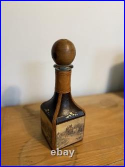 Fausto Conturi Vintage Italian leather-wrapped decanter with embossed scenes