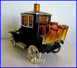 Vintage 1970's Ford Automobile Music Box Decanter with 6 Shot Glass. Working