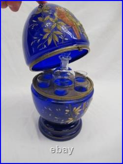 Vintage Czech blue glass Cellarette Tantalus, hand painted with decanter glasses