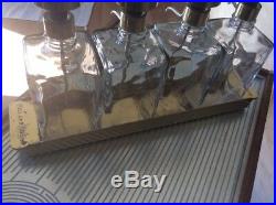 Vintage Glass Liquor Decanter Set of 4 on Brass. Tray