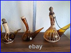 Vintage MCM 1960s Glass Amber Handblown Rattan Spanish Porron Decanters. Set (3)