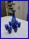 Vintage-cobalt-blue-glass-decanter-and-six-glasses-with-silver-overlay-01-lilh