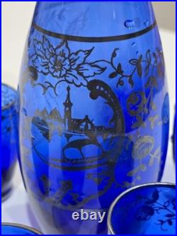 Vintage cobalt blue glass decanter and six glasses with silver overlay