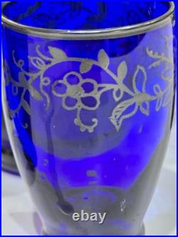 Vintage cobalt blue glass decanter and six glasses with silver overlay