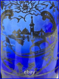 Vintage cobalt blue glass decanter and six glasses with silver overlay