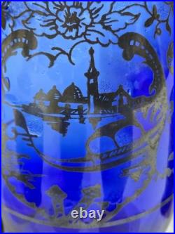 Vintage cobalt blue glass decanter and six glasses with silver overlay