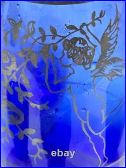 Vintage cobalt blue glass decanter and six glasses with silver overlay