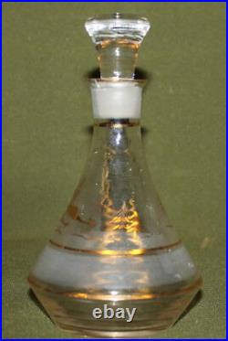 Vintage gilded glass decanter