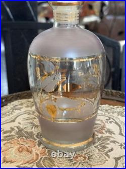 Vintage glass decanter with gold gilt detailing and a stopper
