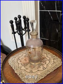 Vintage glass decanter with gold gilt detailing and a stopper