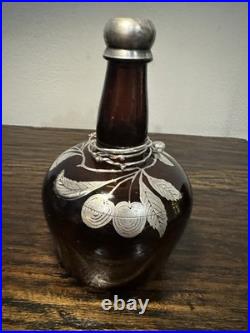 Vintage or antique silver overlay glass decanter or bottle