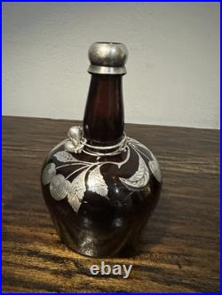 Vintage or antique silver overlay glass decanter or bottle