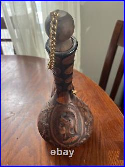 Vintage tooled leatherd covered glass decanter