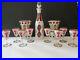 Vtg-Bohemian-Czech-White-cut-to-Cranberry-Decanter-Setwith8-Cordials-and-2-Goblets-01-qb